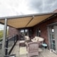 Plaza Viva terrasoverkapping op penthouse dakterras 5e verdieping Nijmegen met RAL 7039 kleur en warm doek